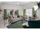 Cozy living room featuring comfortable seating, natural light, and modern décor, ideal for relaxation and entertaining at 1010 Central Ave # 227, St Petersburg, FL 33705
