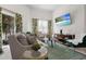 Inviting living area with a comfortable sofa, bright windows, and stylish decor, creating a welcoming ambiance at 1010 Central Ave # 227, St Petersburg, FL 33705
