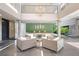 Inviting lobby area with comfortable seating, modern lighting, and lush green accents, creating a welcoming atmosphere at 1010 Central Ave # 227, St Petersburg, FL 33705