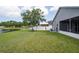 Spacious backyard with lush grass and scenic views of the pond at 10811 Lakeside Vista Dr, Riverview, FL 33569
