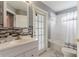 Bathroom featuring single sink, decorative backsplash, and shower over tub at 10811 Lakeside Vista Dr, Riverview, FL 33569