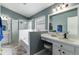 Bathroom featuring double sinks, separate glass enclosed shower, and soaking tub at 10811 Lakeside Vista Dr, Riverview, FL 33569