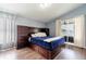 Comfortable bedroom with custom built-ins and view of the lake at 10811 Lakeside Vista Dr, Riverview, FL 33569