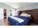 Comfortable bedroom with custom built-ins, walk-in closet, and ensuite at 10811 Lakeside Vista Dr, Riverview, FL 33569