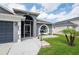 Charming single Gathering home with a two-car garage, front yard, and well-maintained landscaping at 10811 Lakeside Vista Dr, Riverview, FL 33569