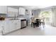 Clean kitchen featuring stainless steel appliances, a window and a cozy breakfast nook area at 10811 Lakeside Vista Dr, Riverview, FL 33569