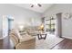 Spacious living room boasts hardwood floors, vaulted ceilings and access to the lanai at 10811 Lakeside Vista Dr, Riverview, FL 33569