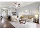 Bright living room featuring high ceilings, modern decor, and comfortable seating arrangement at 10811 Lakeside Vista Dr, Riverview, FL 33569
