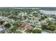 This aerial view shows the home's position in a quiet, established neighborhood with easy access to the nearby lake at 10954 96Th St, Largo, FL 33773