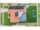Aerial view of the property showcasing a private backyard with a pool and solar panels for energy efficiency at 10954 96Th St, Largo, FL 33773