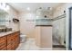 Bathroom with walk-in shower, vanity, and neutral color scheme at 10954 96Th St, Largo, FL 33773