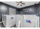 Cozy bedroom featuring 'Puppy Ave' decor with a ceiling fan and window blinds at 10954 96Th St, Largo, FL 33773