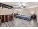 Large main bedroom with ceiling fan, wood-look floors, and a large dresser at 10954 96Th St, Largo, FL 33773
