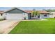 Charming single-story home features a well-manicured lawn and an attached garage at 10954 96Th St, Largo, FL 33773