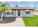 Charming home with well-maintained landscaping, including a palm tree at 10954 96Th St, Largo, FL 33773