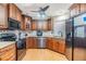 A well-equipped kitchen with stainless steel appliances and wooden cabinets at 10954 96Th St, Largo, FL 33773
