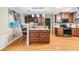 A kitchen featuring granite countertops, dark wood cabinets, and stainless steel appliances at 10954 96Th St, Largo, FL 33773