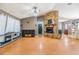 Spacious living room featuring a stone fireplace, wood floors, and ample natural light at 10954 96Th St, Largo, FL 33773
