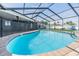 Beautiful private pool with a screened enclosure and a brick surround at 10954 96Th St, Largo, FL 33773