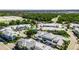Community aerial showcases colorful coastal homes, lush trees, and well-maintained landscapes at 110 Aberdeen Pond Dr, Apollo Beach, FL 33572