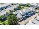 A high-angle aerial shot showcases an attractively landscaped home with a metal roof and inviting curb appeal at 110 Aberdeen Pond Dr, Apollo Beach, FL 33572