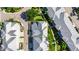 Directly above, the house is neatly framed by others and green spaces, all unified with modern metal roofing at 110 Aberdeen Pond Dr, Apollo Beach, FL 33572