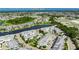 Excellent aerial shot of a waterfront property near Tampa Bay in a neighborhood of similar homes surrounded by waterways at 110 Aberdeen Pond Dr, Apollo Beach, FL 33572