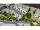 Aerial perspective of colorfully-decorated coastal homes surrounded by lush greenery and waterfront scenery at 110 Aberdeen Pond Dr, Apollo Beach, FL 33572