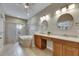 Bright bathroom featuring a double vanity, soaking tub, and glass-enclosed shower at 110 Aberdeen Pond Dr, Apollo Beach, FL 33572