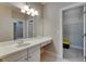 Bathroom featuring a large mirror, vanity with cabinets, and a walk-in closet at 110 Aberdeen Pond Dr, Apollo Beach, FL 33572