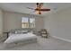 Bright bedroom featuring a large bed with drawers, a ceiling fan, and a window view at 110 Aberdeen Pond Dr, Apollo Beach, FL 33572