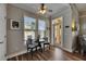 Inviting breakfast nook with a table, chairs, and a view of the outdoors through large windows at 110 Aberdeen Pond Dr, Apollo Beach, FL 33572