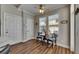 Cozy breakfast nook with a small table, two chairs, and natural light from the windows at 110 Aberdeen Pond Dr, Apollo Beach, FL 33572