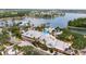 Aerial view of the community clubhouse, pool, and lake, surrounded by lush landscaping at 110 Aberdeen Pond Dr, Apollo Beach, FL 33572