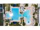 Top-down view of a spacious community pool with a water slide and many seating options at 110 Aberdeen Pond Dr, Apollo Beach, FL 33572