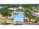 Aerial view of the community pool area with water slides and palm tree landscaping at 110 Aberdeen Pond Dr, Apollo Beach, FL 33572