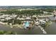 Overhead view of the lakefront community pool with boat slips, palm trees, and outdoor recreational activities at 110 Aberdeen Pond Dr, Apollo Beach, FL 33572