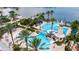 Large community pool and lazy river featuring a lighthouse and views of the lake at 110 Aberdeen Pond Dr, Apollo Beach, FL 33572