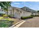 Beautifully landscaped home featuring a pristine white fence, manicured hedges, and lush green lawn at 110 Aberdeen Pond Dr, Apollo Beach, FL 33572
