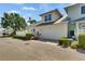 Charming two-story home featuring a two-car garage, well-maintained landscaping, and a welcoming curb appeal at 110 Aberdeen Pond Dr, Apollo Beach, FL 33572