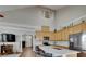 Bright kitchen with modern appliances and marble countertops, connecting to the living room at 110 Aberdeen Pond Dr, Apollo Beach, FL 33572