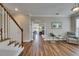 Inviting living area with hardwood floors and an arched doorway leading to another room at 110 Aberdeen Pond Dr, Apollo Beach, FL 33572