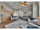 Open concept living area with kitchen island and hardwood floors at 110 Aberdeen Pond Dr, Apollo Beach, FL 33572