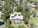Aerial view of this beautiful home with a screened pool, solar panels and a winding driveway at 1141 Myrtle Rd, Valrico, FL 33596