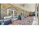 Covered brick patio with ceiling fans and outdoor grill, perfect for outdoor dining and entertainment at 1141 Myrtle Rd, Valrico, FL 33596