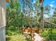 Lush backyard features a wooden deck with views of the waterway at 1141 Myrtle Rd, Valrico, FL 33596