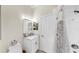 Clean bathroom showcasing a toilet, single vanity with marble countertop, and shower with curtain at 1141 Myrtle Rd, Valrico, FL 33596