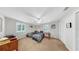 Bedroom with two twin beds, ceiling fan, and natural light from the windows at 1141 Myrtle Rd, Valrico, FL 33596