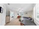 Bedroom with carpet, ceiling fan, and an open doorway to the kitchen at 1141 Myrtle Rd, Valrico, FL 33596