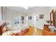 Comfortable bedroom featuring hardwood floors, plantation shutters, and neutral décor at 1141 Myrtle Rd, Valrico, FL 33596